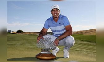 Brooks Koepka poses with the Phoenix Open trophy