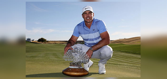 Brooks Koepka poses with the Phoenix Open trophy