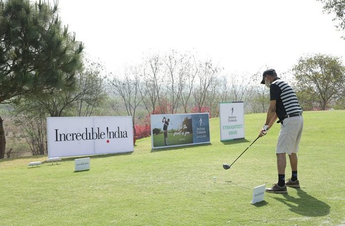 Golfer tees off at the 10th for the Indian Terrain Straightest drive contest