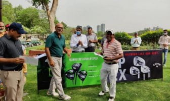 Caddie Bijender receiving his Best Gross Trophy