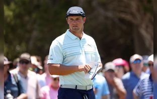 Top players stand against green reading books