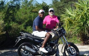 Brian Lara poses on Hero Bike with Dr Pawan Munjal
