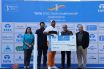 Udayan Mane receives the winner's cheque and trophy from Mr. T V Narendran, CEO & Managing Director, TATA Steel. The other dignitaries in the picture are Mr. Sanjiv Paul, Vice President (Safety, Health & Sustainability), TATA Steel (extreme right), Mrs. Ruchi Narendran (extreme left) and Mr. Uttam Singh Mundy, CEO, PGTI (2nd from left).