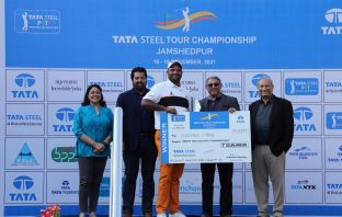 Udayan Mane receives the winner's cheque and trophy from Mr. T V Narendran, CEO & Managing Director, TATA Steel. The other dignitaries in the picture are Mr. Sanjiv Paul, Vice President (Safety, Health & Sustainability), TATA Steel (extreme right), Mrs. Ruchi Narendran (extreme left) and Mr. Uttam Singh Mundy, CEO, PGTI (2nd from left).