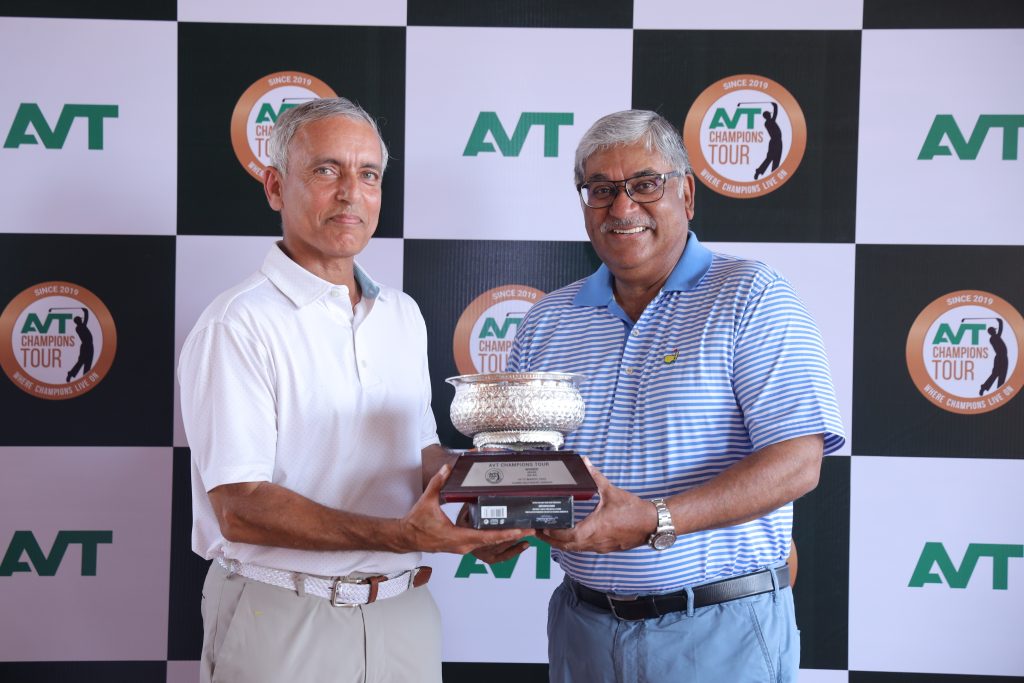 Rishi Narain (Winner 60-64) receiving winning trophy from Dilip Thomas